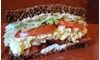 Eating Sandwich Salad at Baggin's Gourmet Sandwiches Cortaro restaurant in Marana, AZ.